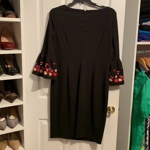 Slimming black dress with beautiful red and gold bell sleeves 3/4 length